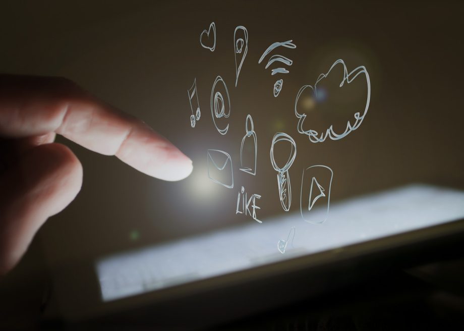 A person’s finger touching a smartphone screen.